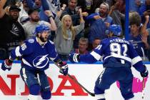 Tampa Bay Lightning right wing Nikita Kucherov, left, celebrates after scoring a goal against t ...