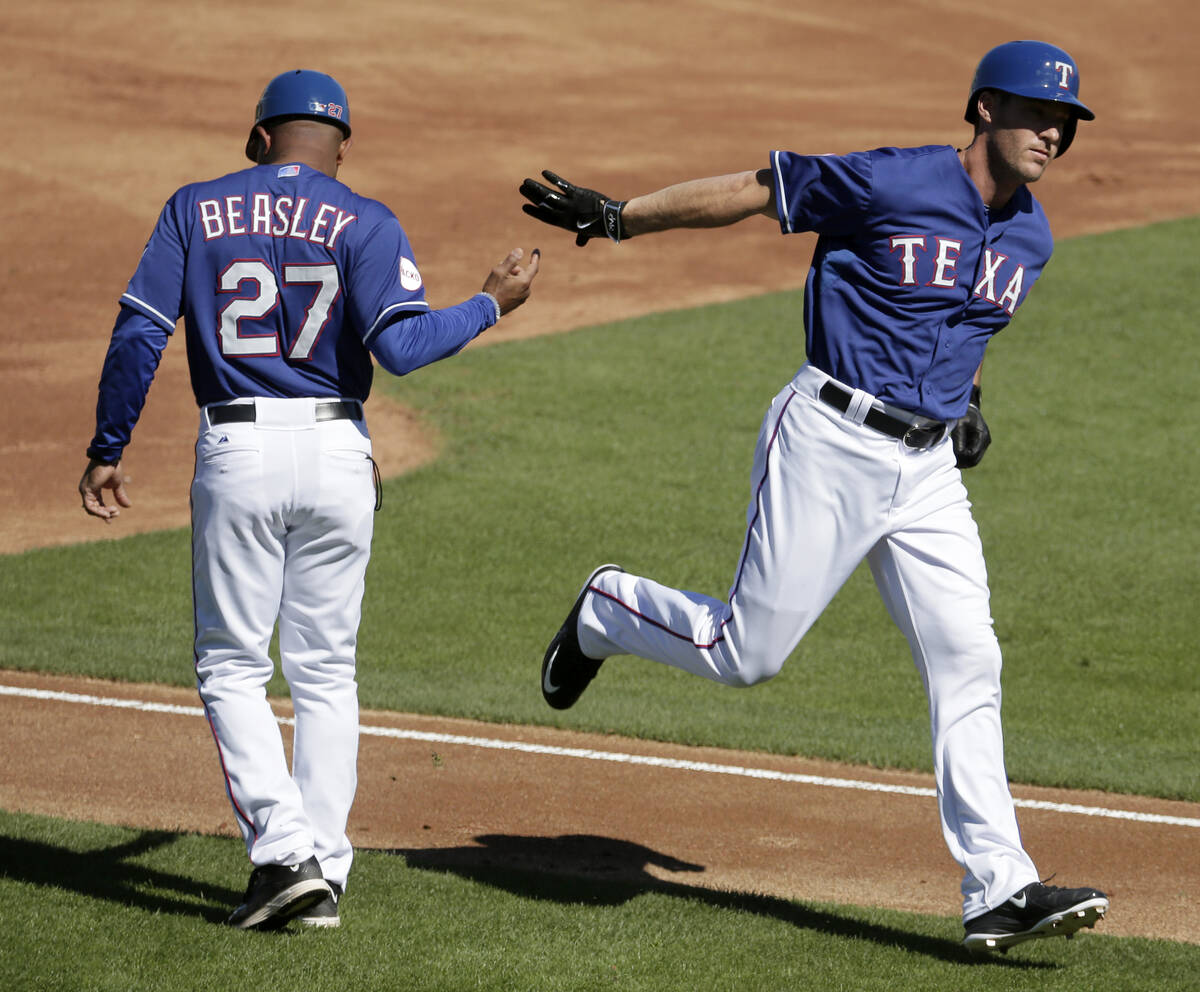 Texas Rangers' Ryan Ludwick, right, celebrates with Texas Rangers third base coach Tony Beasley ...