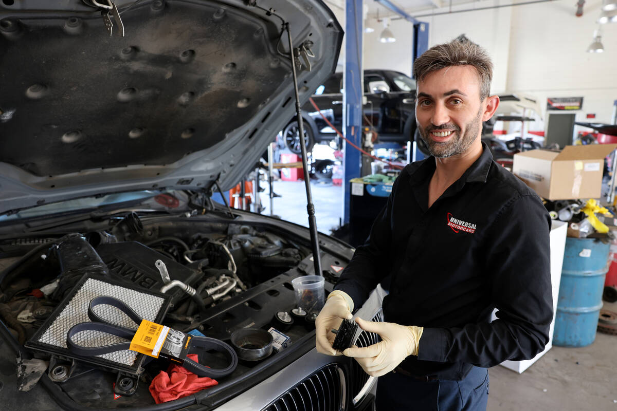 Victor Botnari, owner of Universal Motorcars in Las Vegas, shows a pulley that melted from heat ...