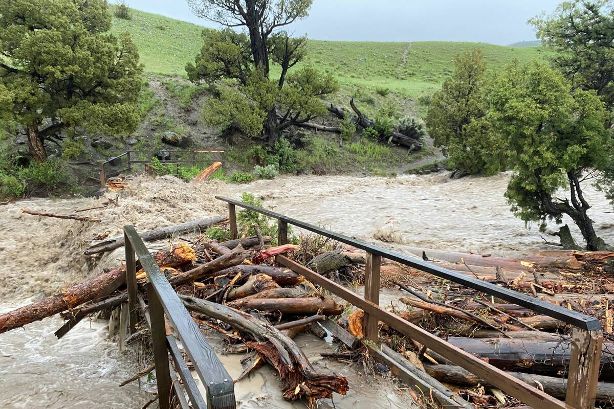 A washed-out bridge from flooding at Rescue Creek in Yellowstone National Park, Mont., is seen ...