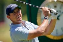 Rory McIlroy, of Northern Ireland, hits a drive on number 13 at The Country Club, Tuesday, June ...