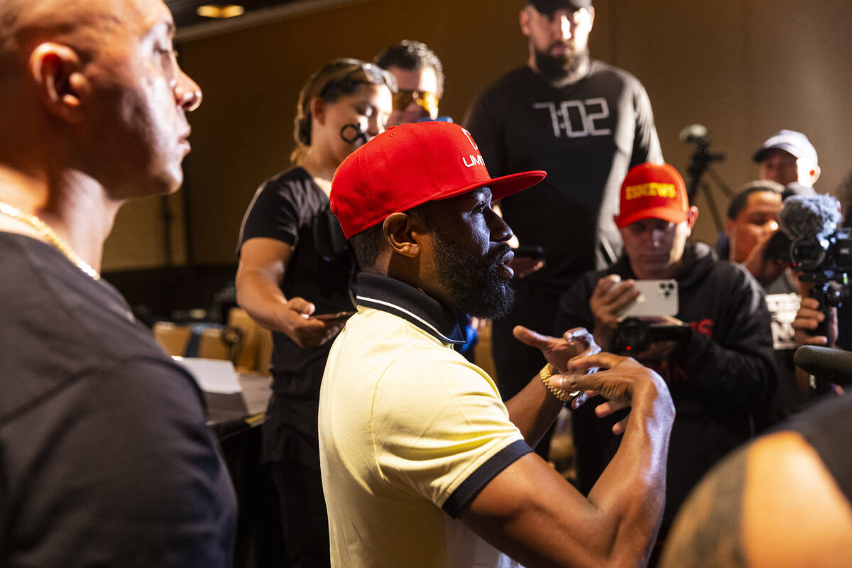 Floyd Mayweather talks with reporters after announcing an exhibition boxing match, that he is s ...