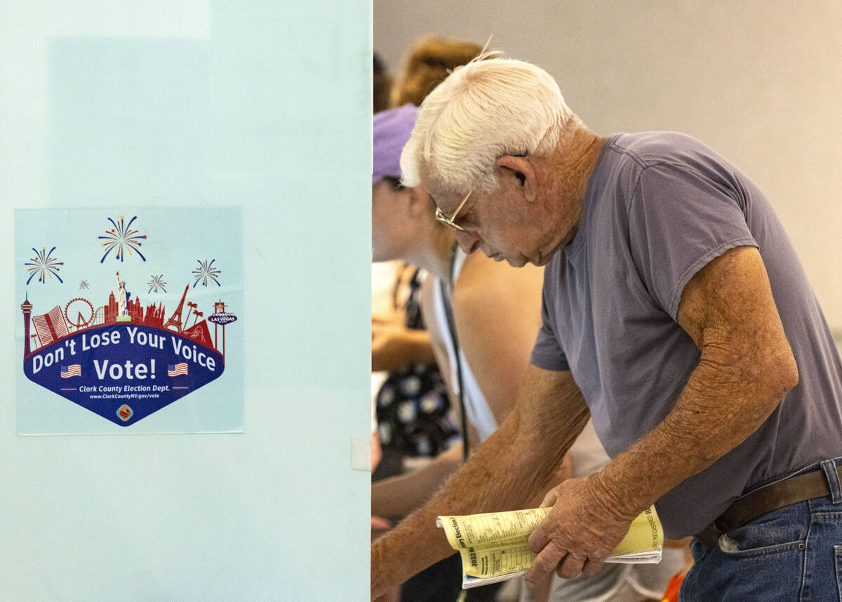 Bill Scott of Las Vegas casts his ballots at Sahara West Library on Tuesday, June 14, 2022, in ...