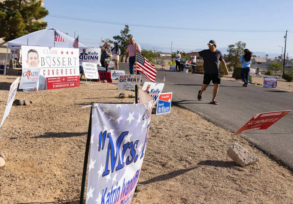 Joel Santiago of Las Vegas leaves a polling station after casting his ballots at Desert Breeze ...