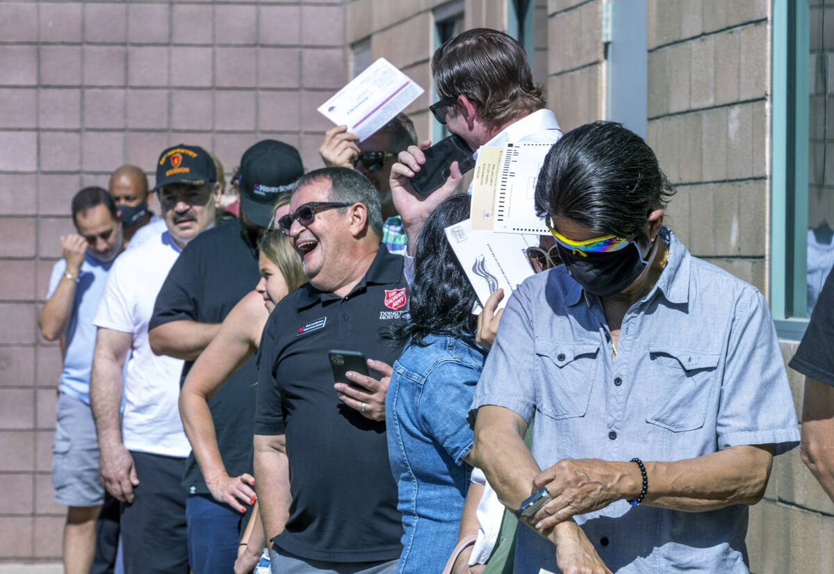Voters wait in the sun to enter for the Nevada primary election taking place at Veterans Memori ...