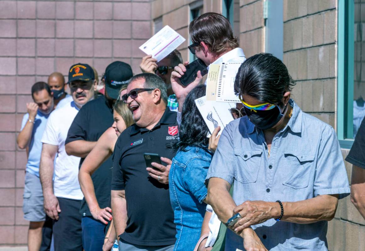 Voters wait in the sun to enter for the Nevada primary election taking place at Veterans Memori ...