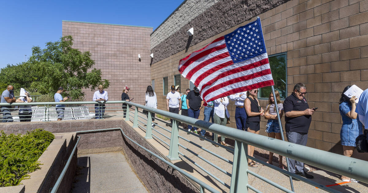 Voters wait in the sun to enter for the Nevada primary election taking place at Veterans Memori ...