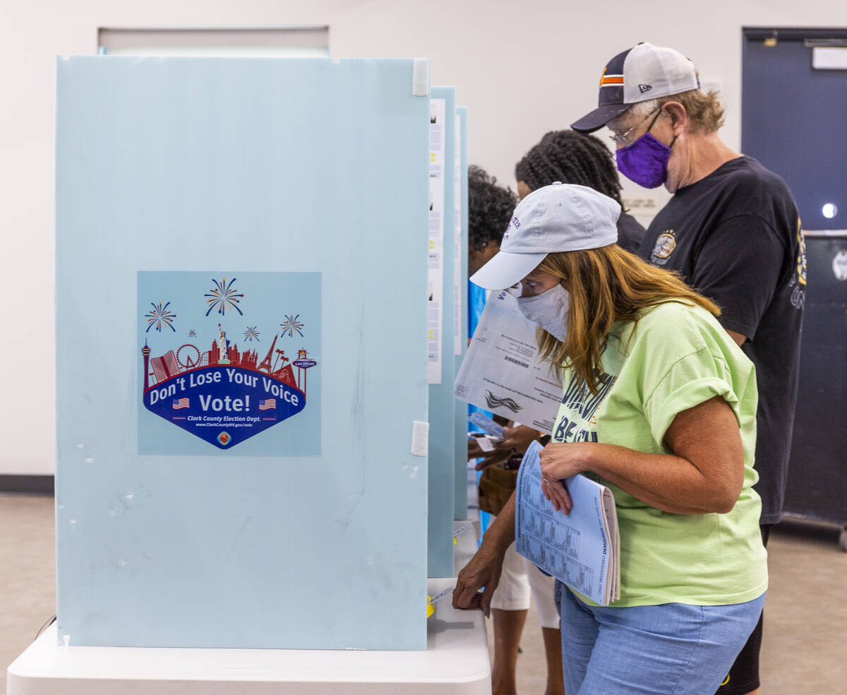 Voters make their selections for the Nevada primary election taking place at Veterans Memorial ...