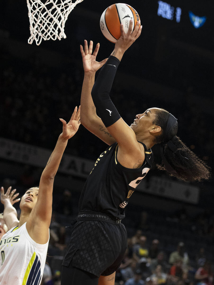Aces forward A'ja Wilson (22) shoots over Dallas Wings forward Satou Sabally (0) in the first h ...