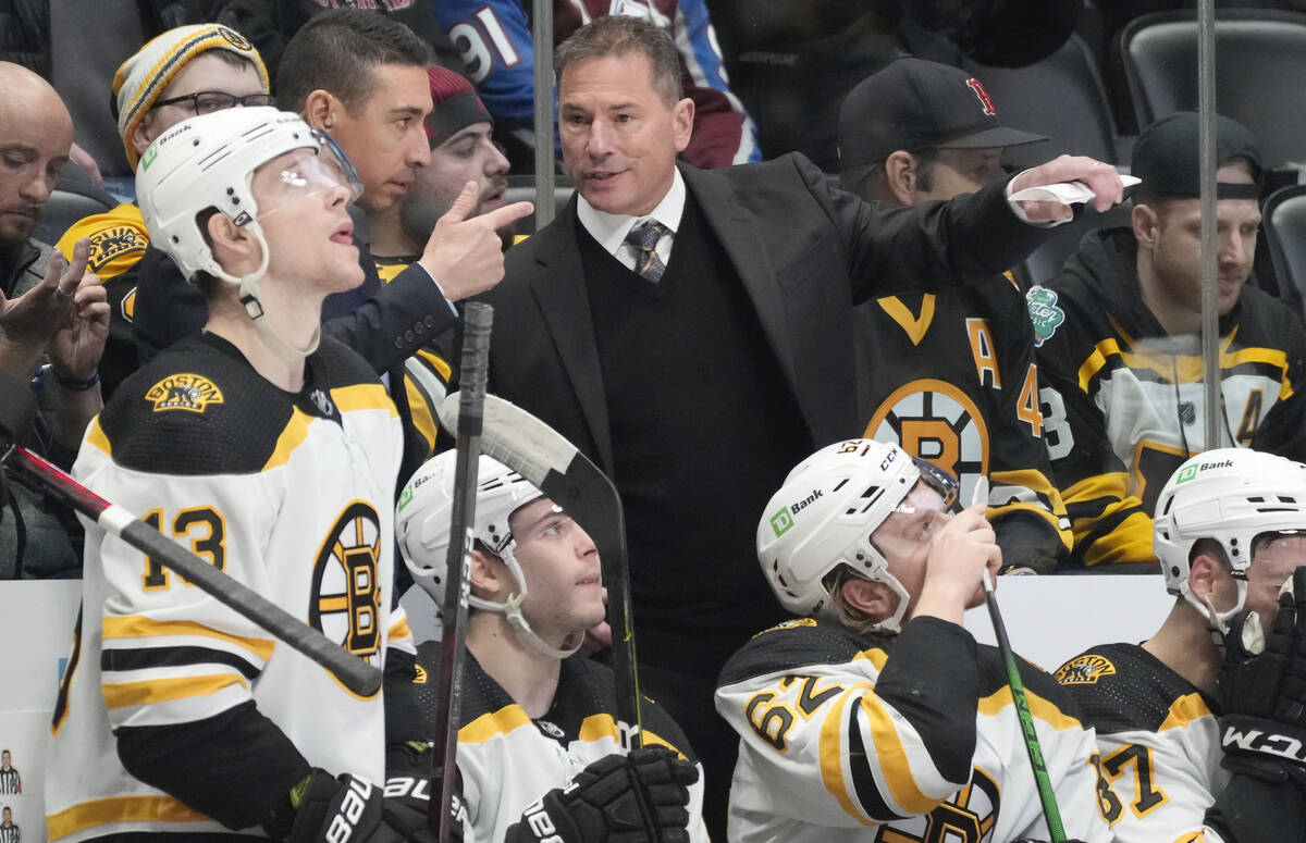 Boston Bruins head coach Bruce Cassidy, right, directs his players in the second period of an N ...