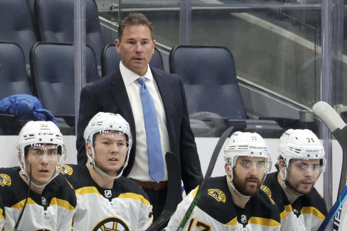 Boston Bruins coach Bruce Cassidy watches during the third period of the team's NHL hockey game ...