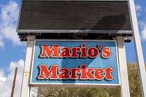 Signage in the parking lot of Mario's Westside Market with a possible move soon into the nearby ...