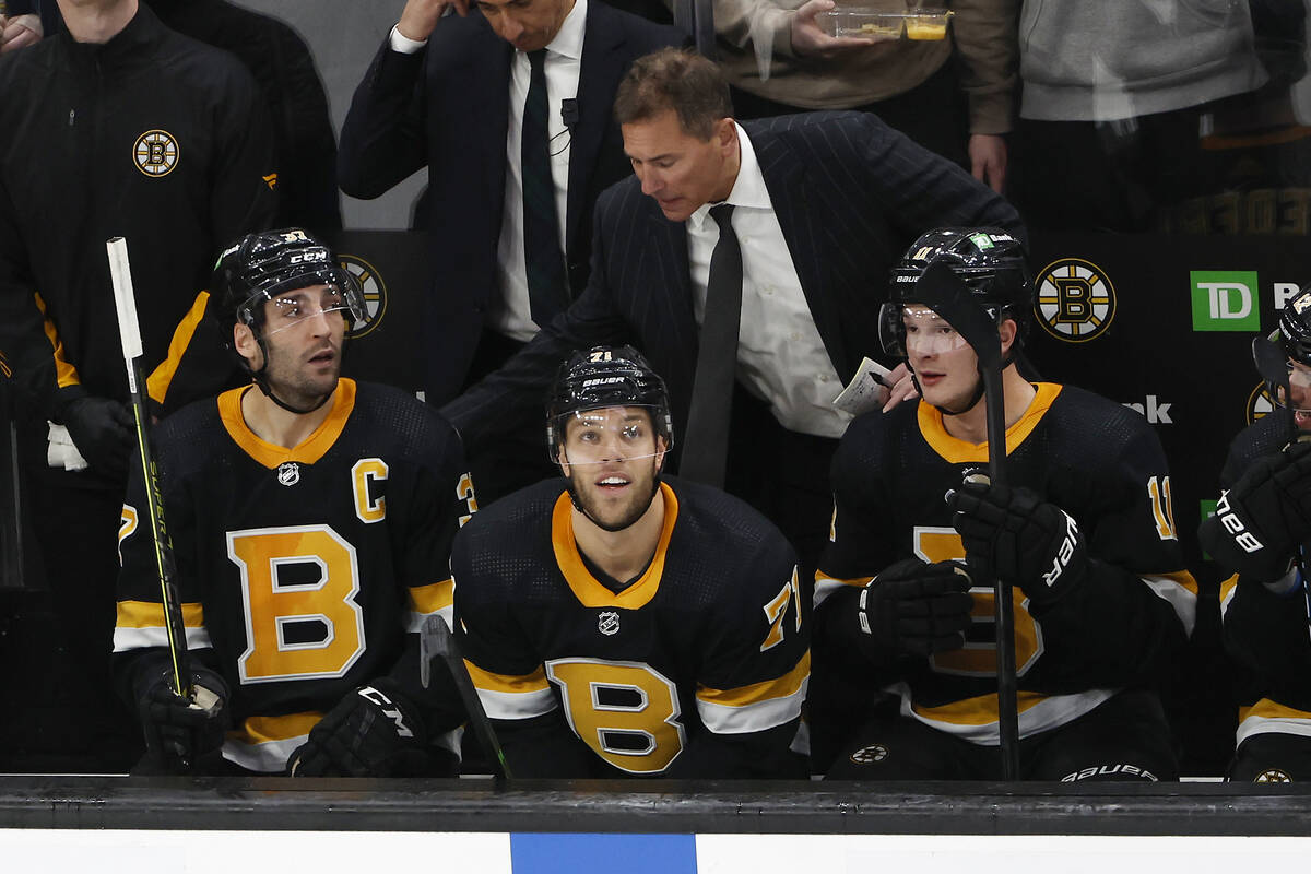 Boston Bruins head coach Bruce Cassidy, top center, congratulates Patrice  Bergeron, left, and T … | Las Vegas Review-Journal