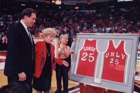 UNLV president Carol Harter presents Glen Gondrezick with his framed jersey during a ceremony r ...