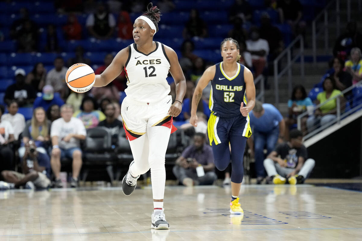 Chelsea Gray #12 of the Las Vegas Aces dribbles the ball during the game against the Dallas Win ...