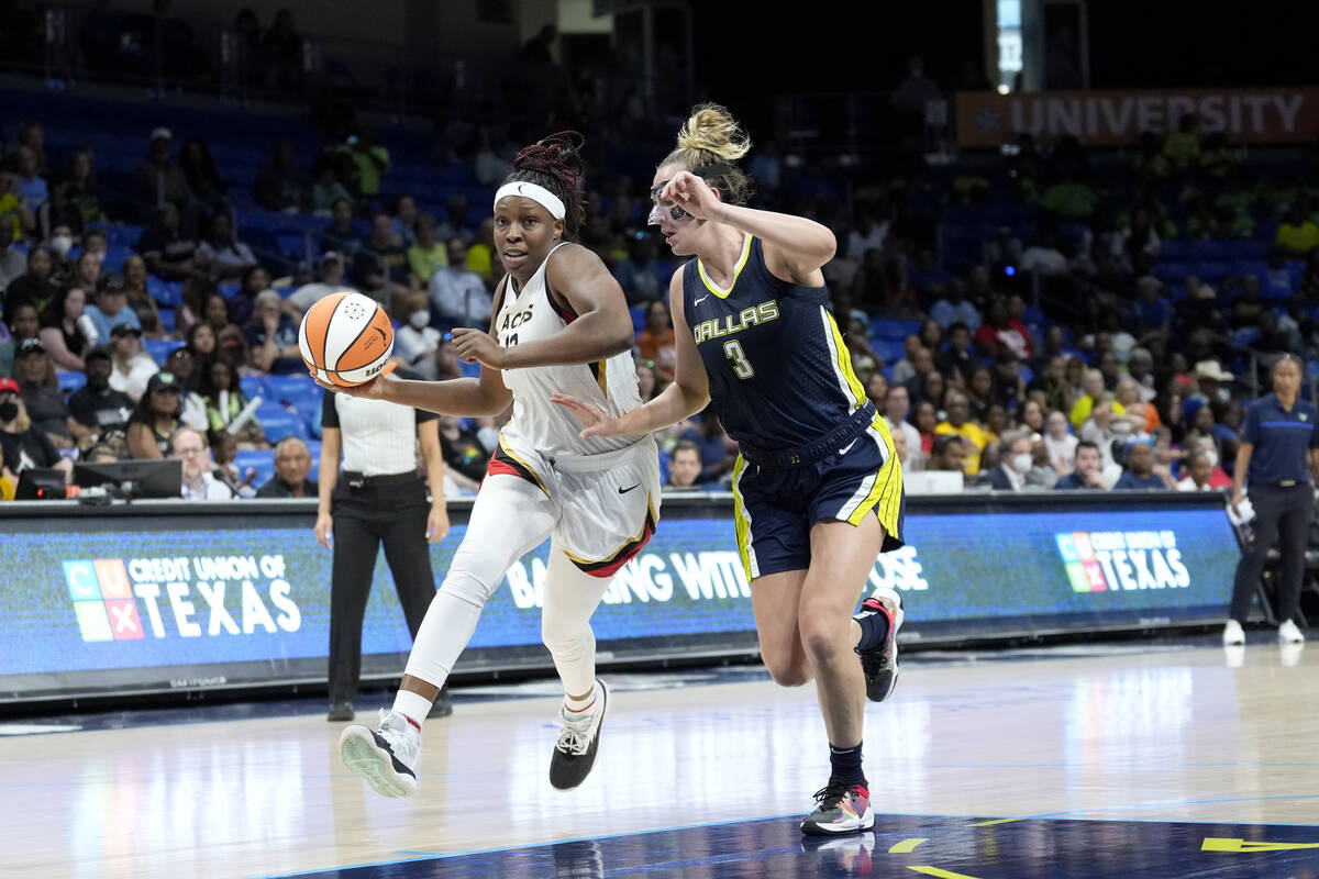 Chelsea Gray #12 of the Las Vegas Aces dribbles the ball during the game against the Dallas Win ...