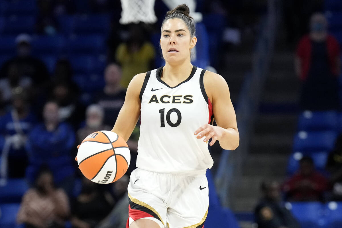 Kelsey Plum #10 of the Las Vegas Aces dribbles the ball during the game against the Dallas Wing ...