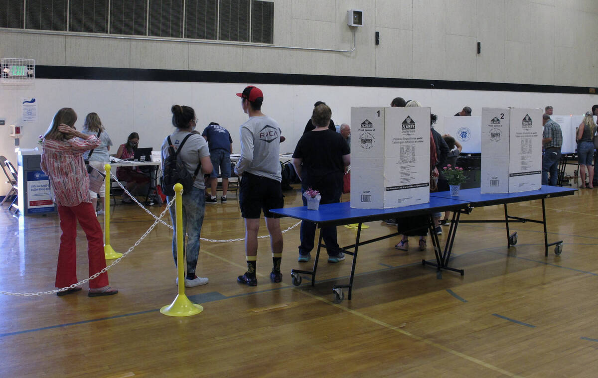 Washoe County voters line up inside a gymnasium at Reed High School in Sparks, Nevada on Tuesda ...