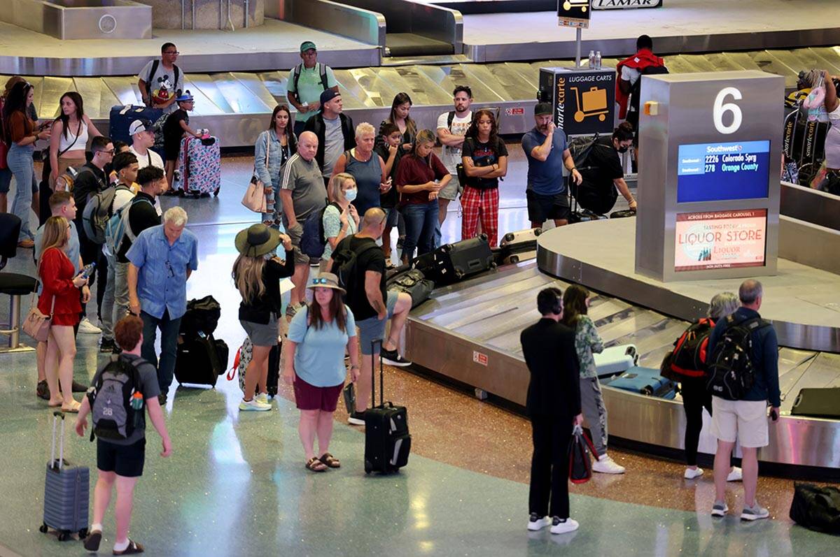 Passengers in baggage claim in Terminal 1 at Harry Reid International Airport Wednesday, June 1 ...