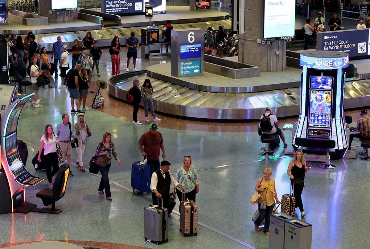 Passengers in baggage claim in Terminal 1 at Harry Reid International Airport Wednesday, June 1 ...
