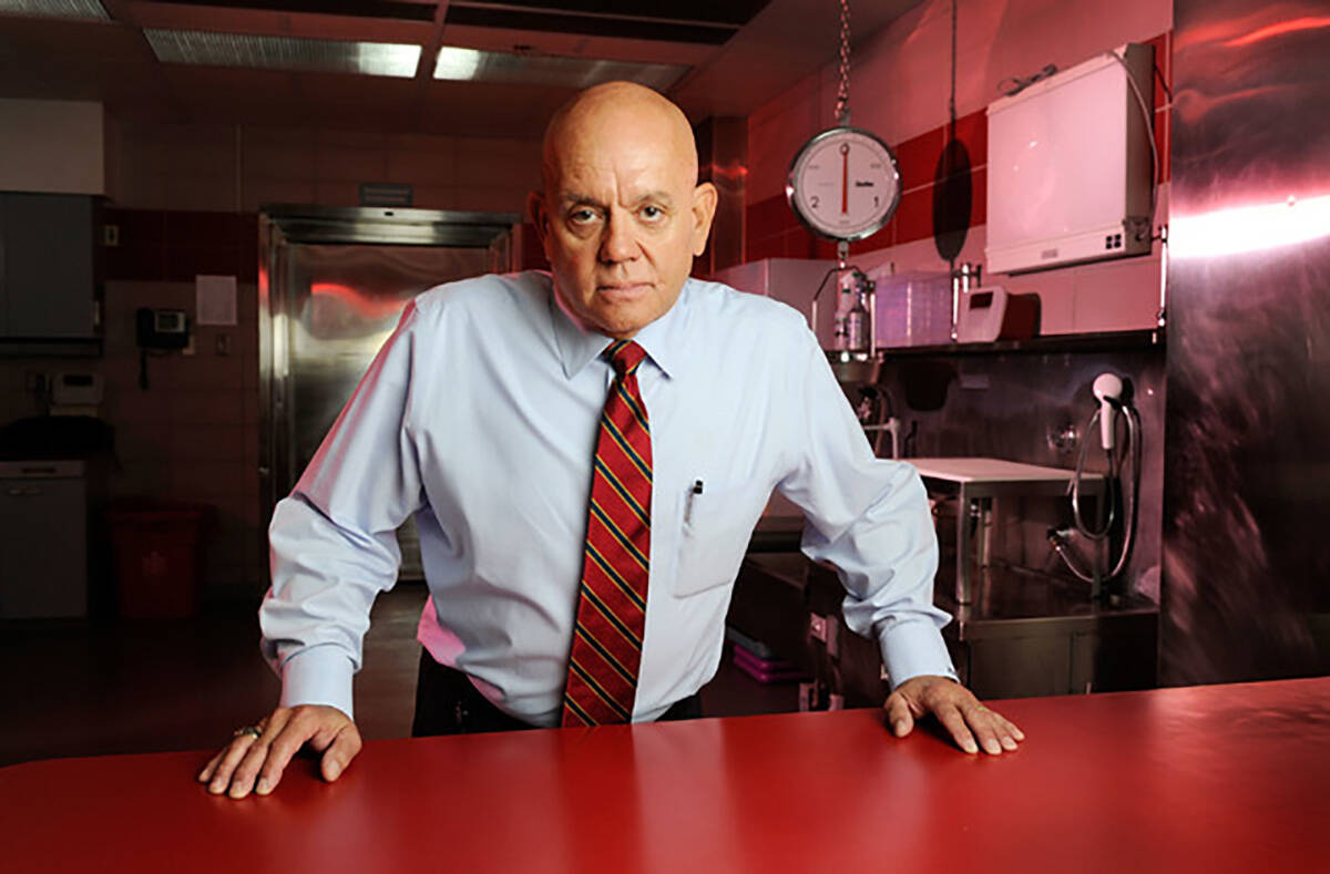 Former Clark County Coroner Michael Murphy poses in one of the autopsy suites at the coroner's ...