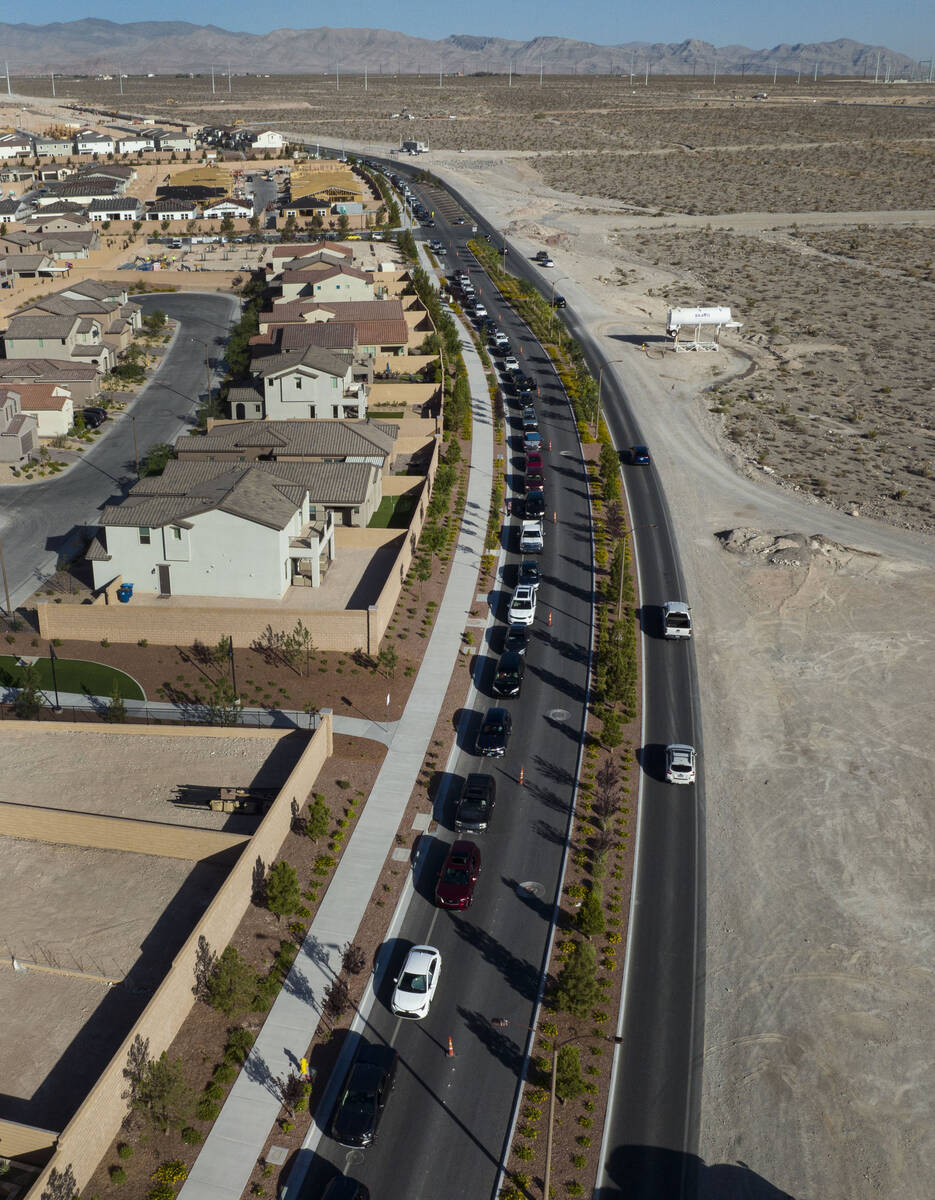 Cars line up to get free gas from Smith’s Marketplace on Thursday June 16, 2022, in Las ...