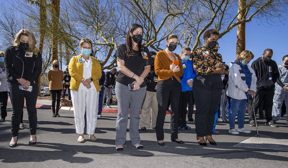 Attendees pray together during a nondenominational city wide prayer event at Southern Hills Hos ...