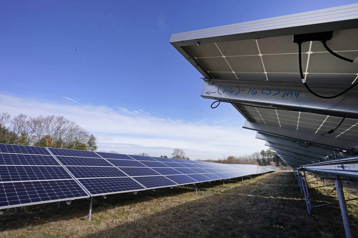 FILE - Solar panels face the sky on Jan. 26, 2021, in Burrillville, R.I., at ISM Solar's 10-acr ...