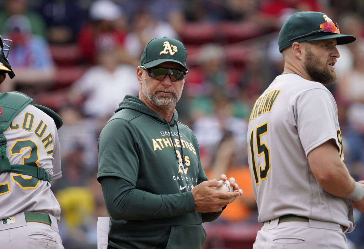Oakland Athletics manager Mark Kotsay, center, waits at the the mound for a new pitcher during ...