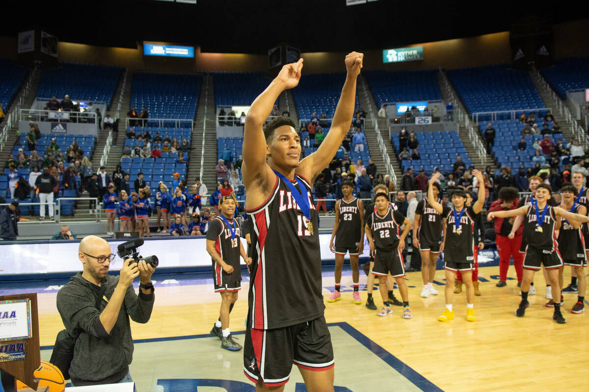 Liberty's KAaron Price celebrates after beating Bishop Gorman in the NIAA Class 5A boys basketb ...