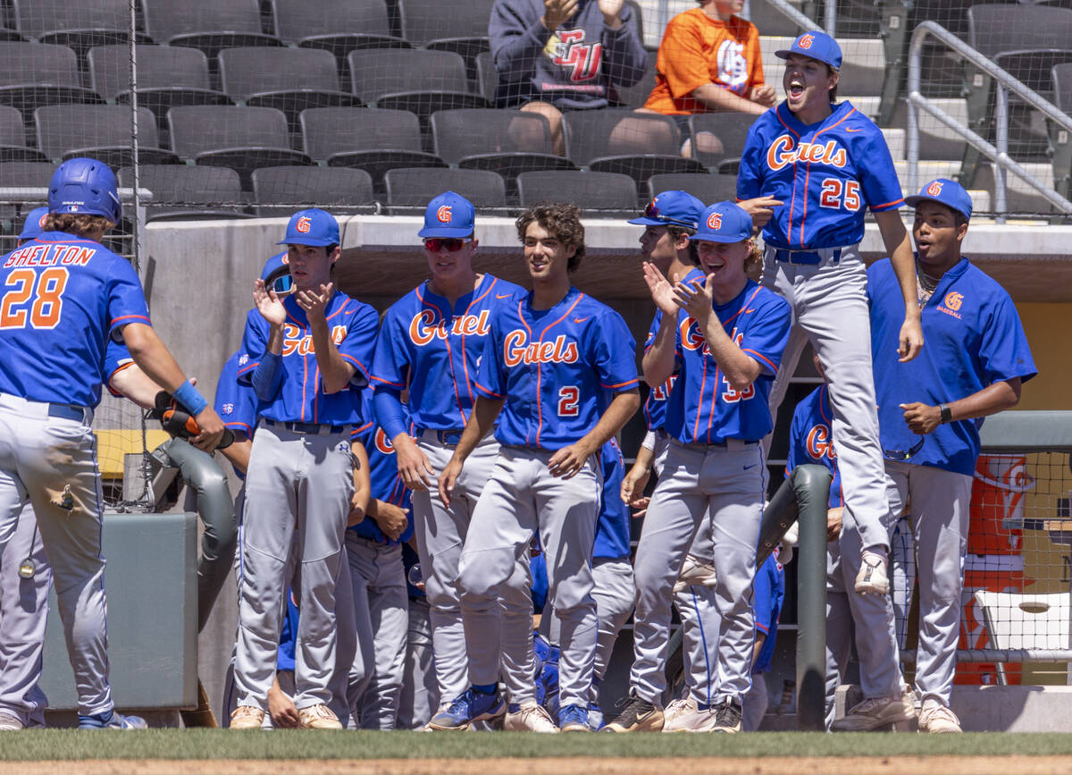 Bishop Gorman players celebrate a score over Basic during their Class 5A state baseball champio ...