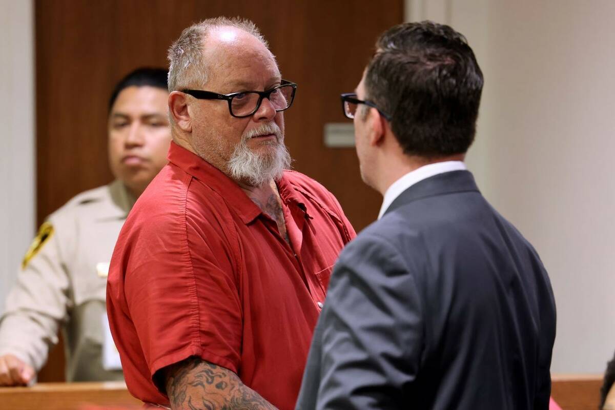Richard Devries, 66, talks to his attorney Robert DeMarco during his initial court appearance i ...