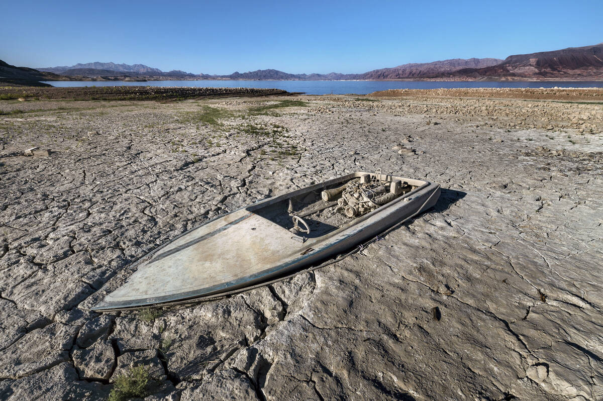 Another sunken boat is revealed as the water level continues to decline near Boulder Harbor at ...