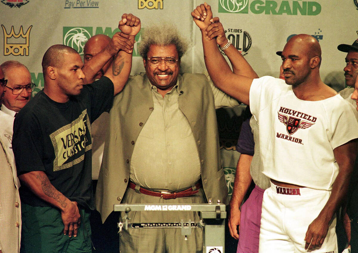NEWS BOXING PROMOTER DON KING RAISES THE ARMS OF MIKE TYSON AND WBA HEAVYWEIGHT CHAMPION EVANDE ...