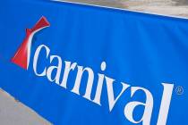 FILE - This Jan. 29, 2021 file photo shows a Carnival Cruise Line sign at PortMiami in Miami. C ...