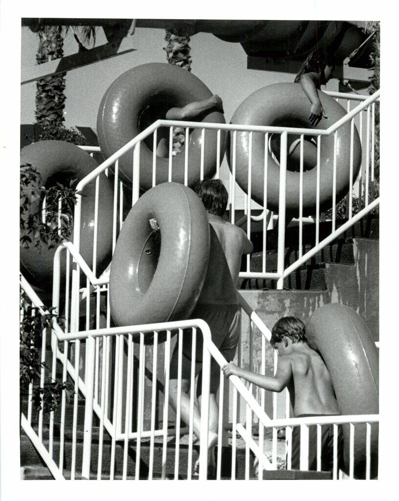 Guests carry inner tubes to the top of a ride at Wet 'n' Wild on the Las Vegas Strip. (Las Vega ...