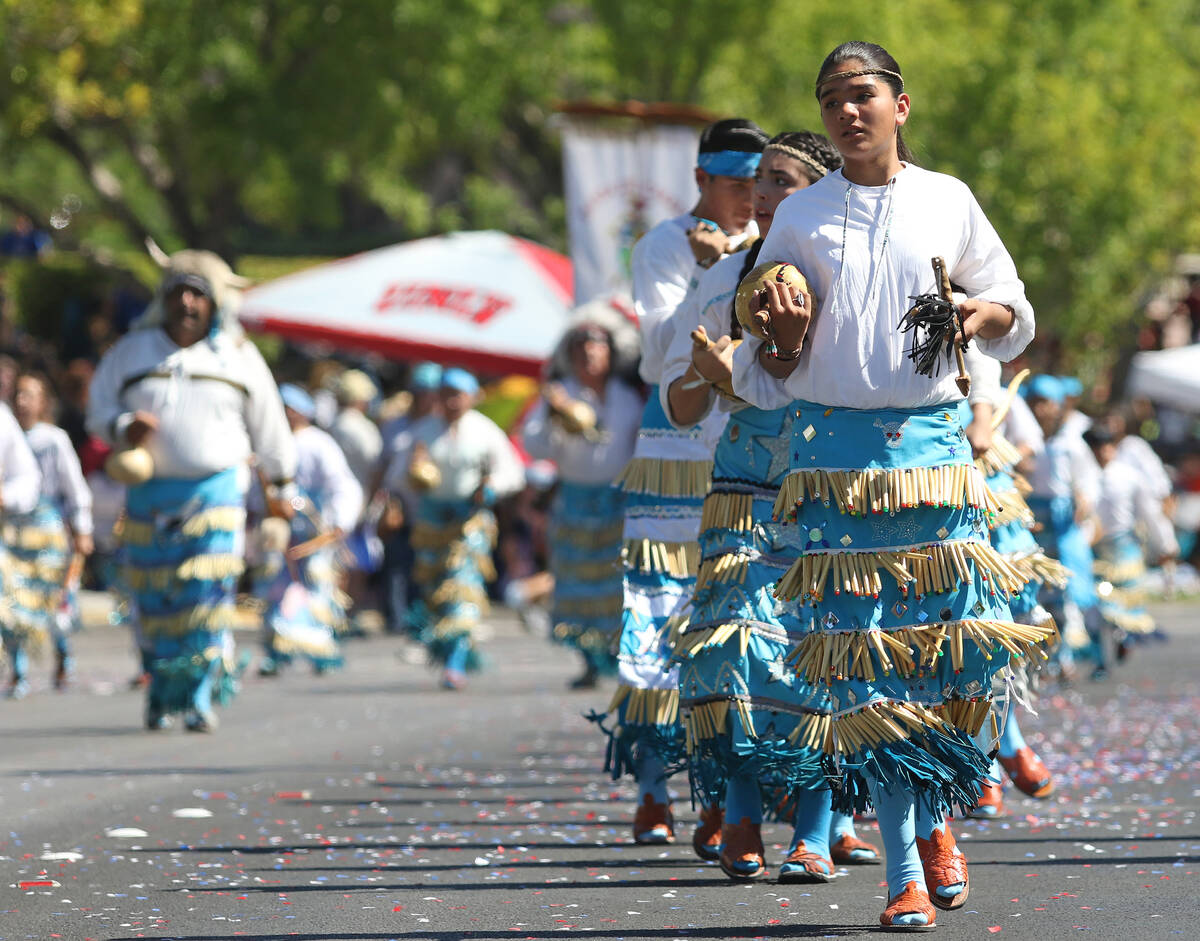 Danza Del Carrizo performers march during the 2016 Summerlin Council Patriotic Parade in Las Ve ...