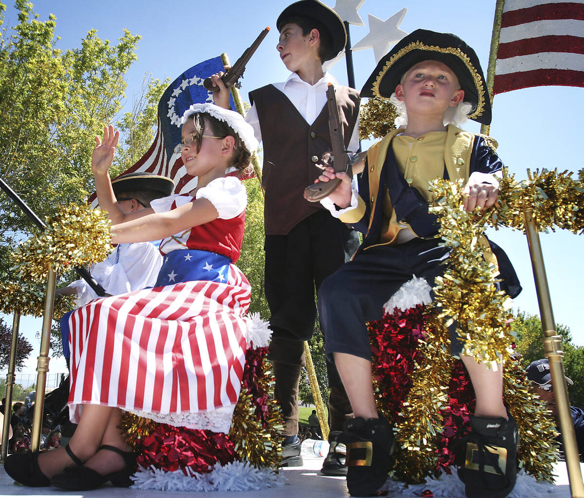 The founding fathers and mother enjoy their ride on a patriotic float during the 2009 Summerlin ...