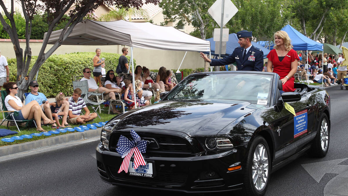 Grand Marshal Col. Barry R. Cornish waves to parade watchers at the 2012 Summerlin Council Patr ...