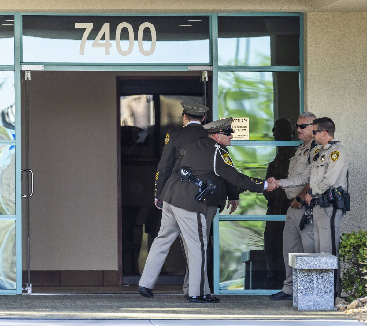 Officers greet during a public viewing for Metro Det. Justin Terry at Palm Cheyenne Mortuary wh ...