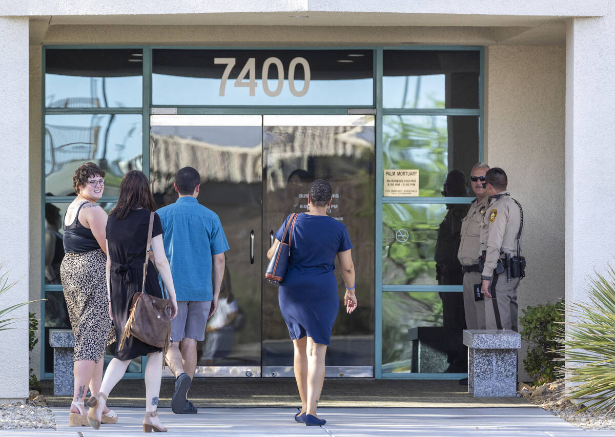 People arrive for a public viewing for Metro Det. Justin Terry at Palm Cheyenne Mortuary who di ...