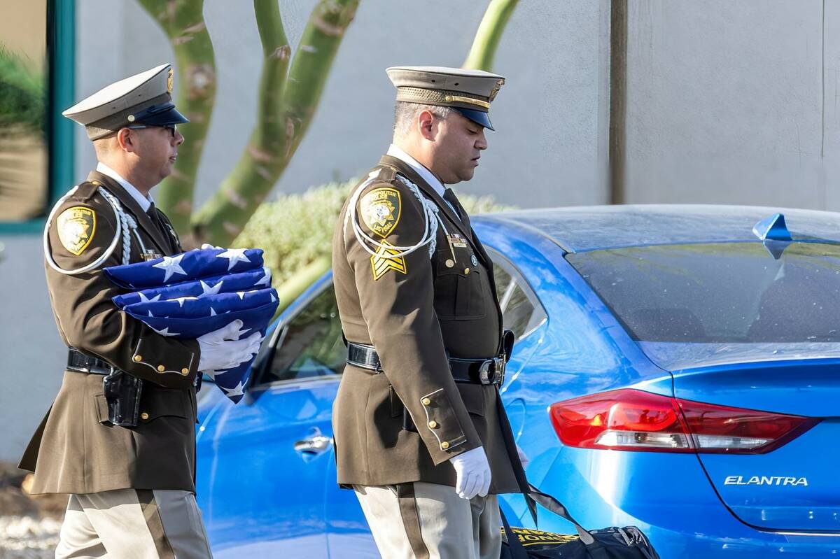 Officers leave a public viewing for Metro Det. Justin Terry at Palm Cheyenne Mortuary who died ...