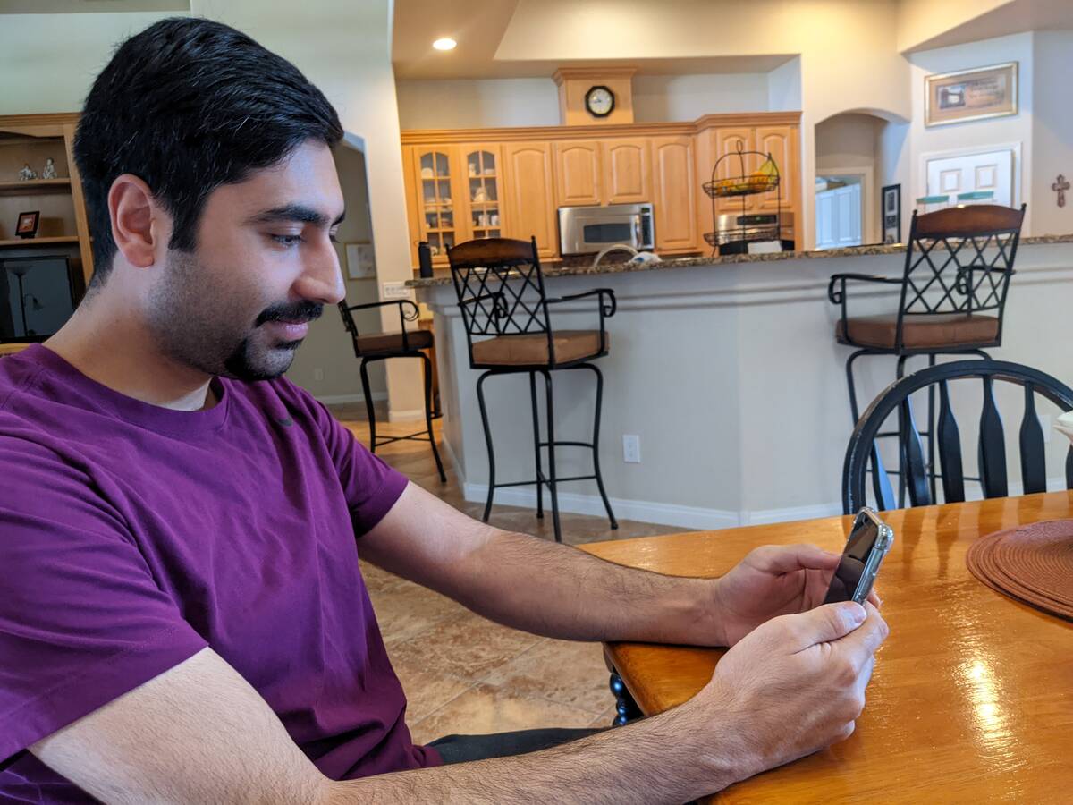 Mohammad "Benny" Shirzad speaks by video chat from Henderson with his wife and parents, who hav ...