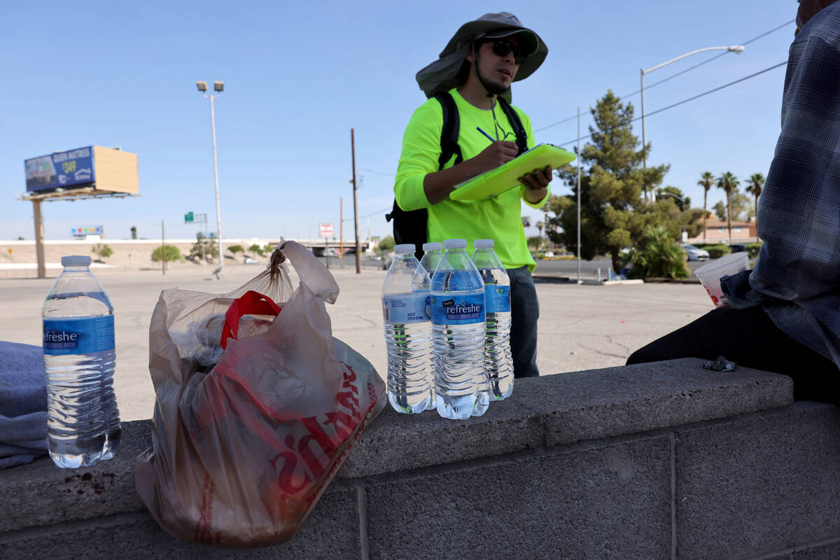 HELP of Southern Nevada’s Jacob Coronado speaks to a homeless person on Boulder Highway in La ...