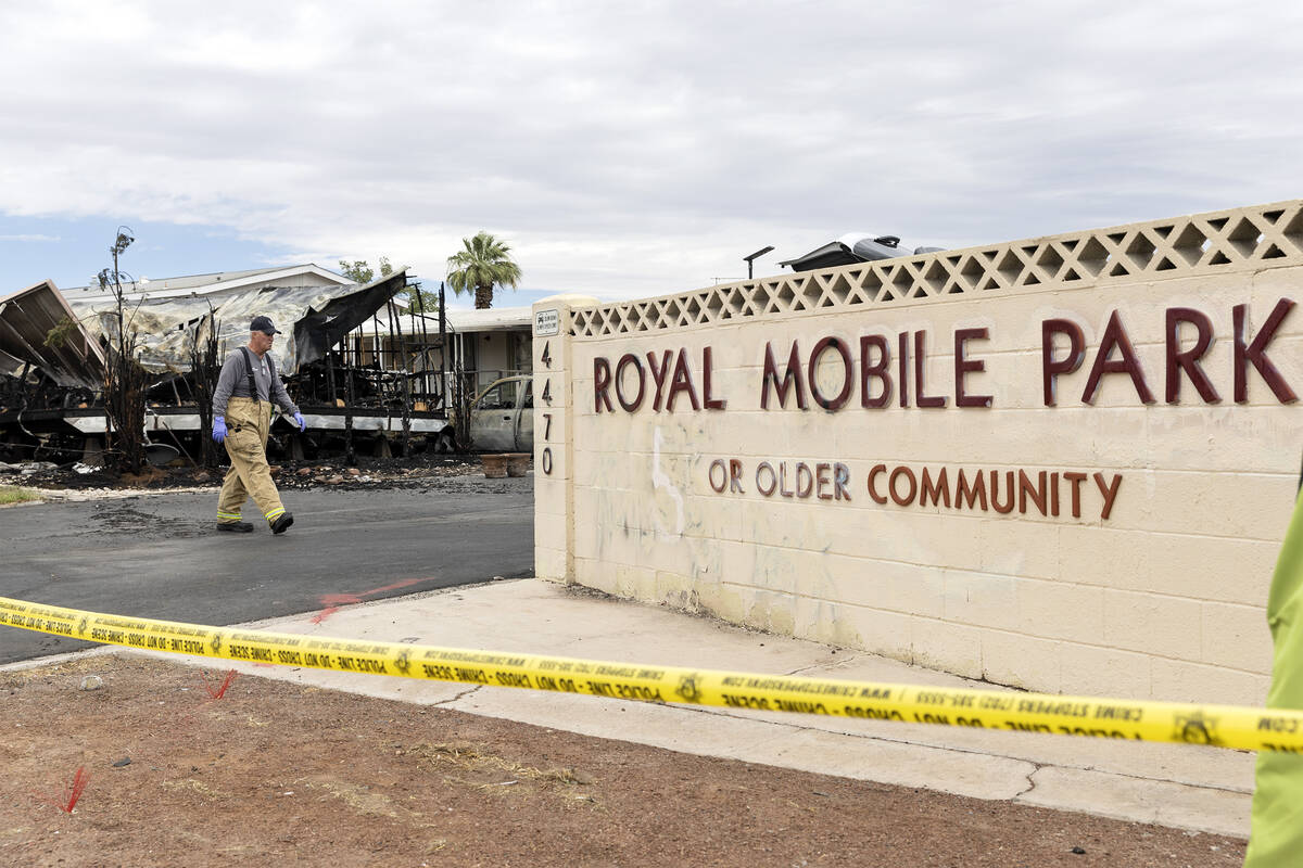 Clark County Fire Department and Las Vegas Fire and Rescue investigate the scene of a fire wher ...