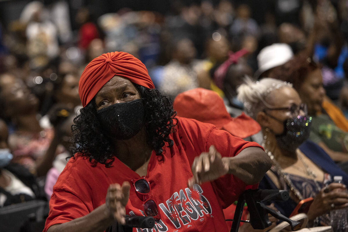 Evelyn Johnson, of Las Vegas, dances to performers during a Juneteenth expo at World Market Cen ...