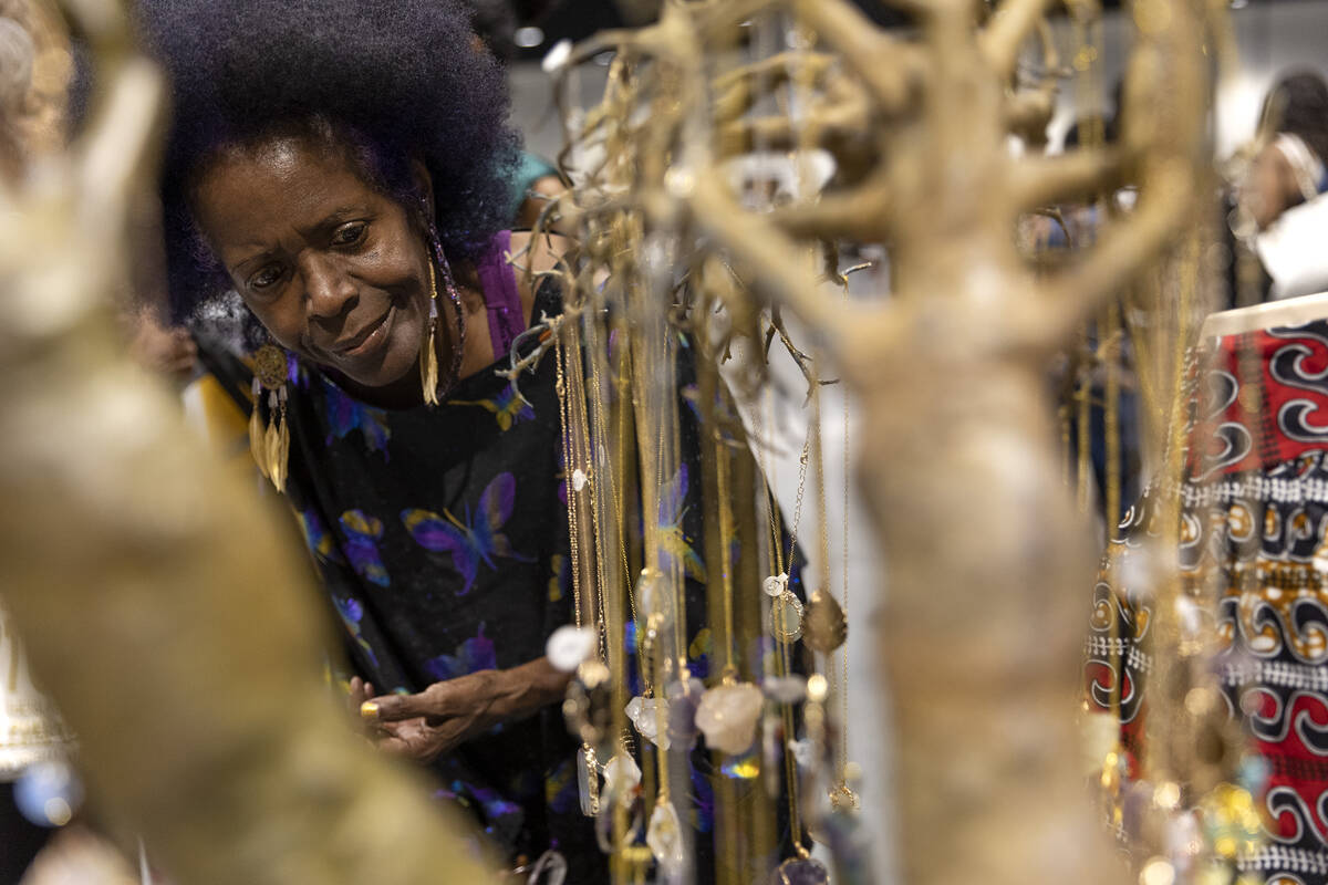 Stephanie DuBois, of Las Vegas, shops for jewelry during a Juneteenth expo at World Market Cent ...