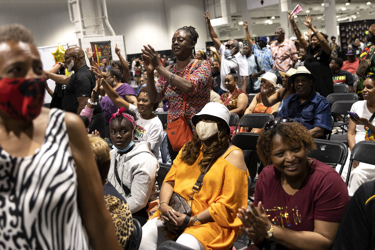 The crowd claps for performers during a Juneteenth expo at World Market Center on Saturday, Jun ...