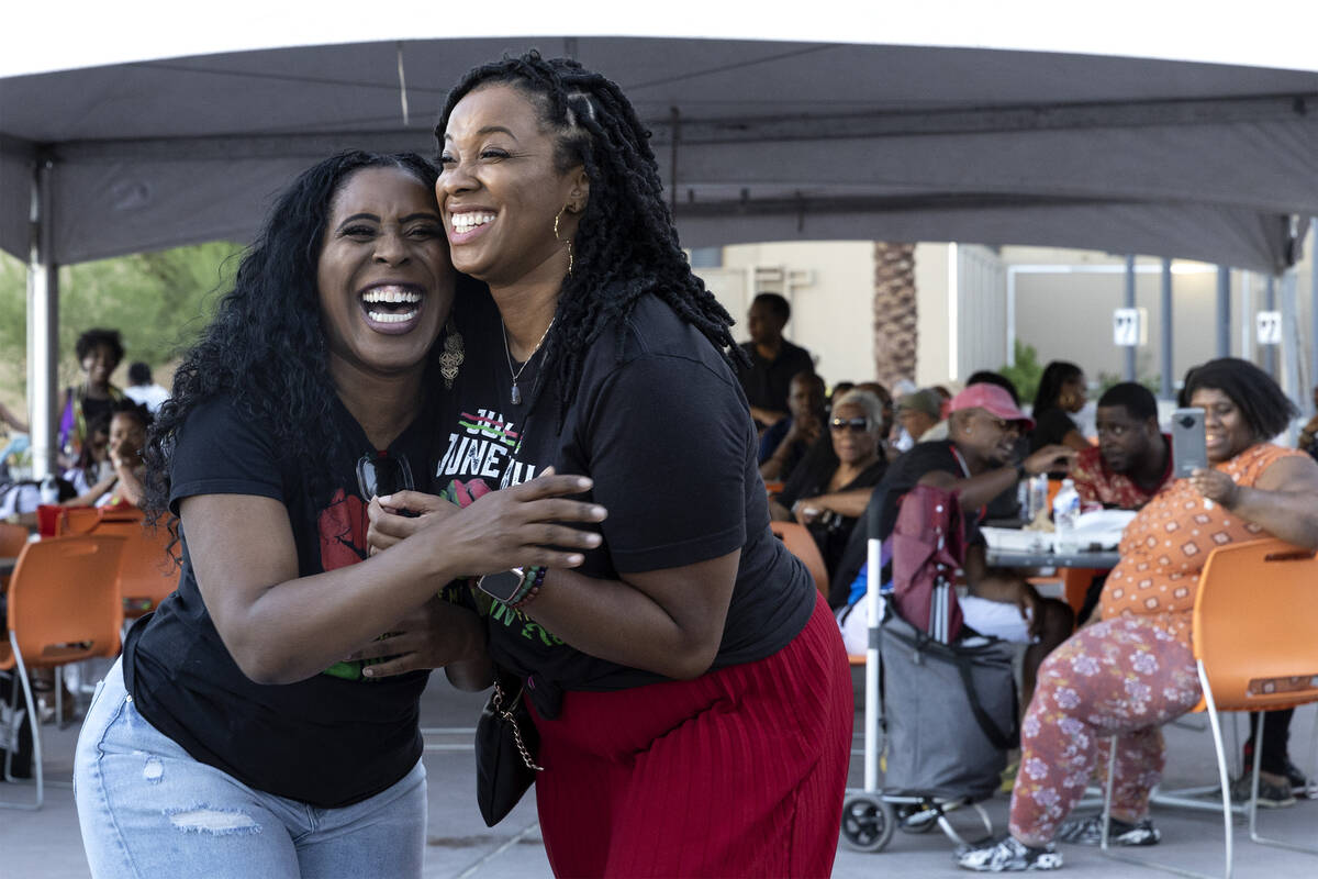 Radio hosts NikatNite, left, and Les’Shon Simpson laugh after dancing to a Beyonce song ...