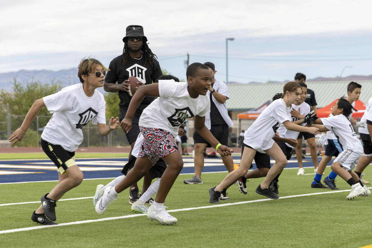 Raiders wide receiver Davante Adams participates in his youth football camp at Spring Valley Hi ...